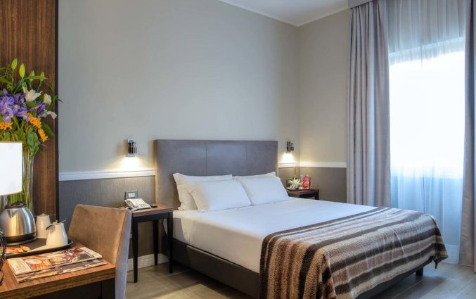 Slaapkamer van Fragrance Hotel St. Peter in Rome