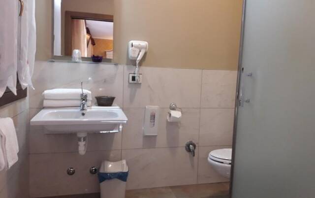 Badkamer van hotel Tinoretto