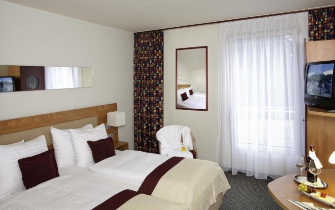 Slaapkamer van Hotel Mercure City in Salzburg