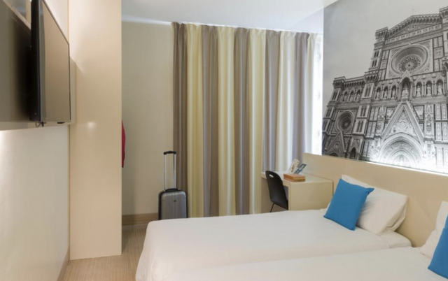 Slaapkamer in hotel B&amp;B Firenze City Center