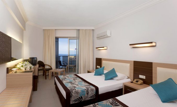 Slaapkamer van Hotel Monart City in Alanya