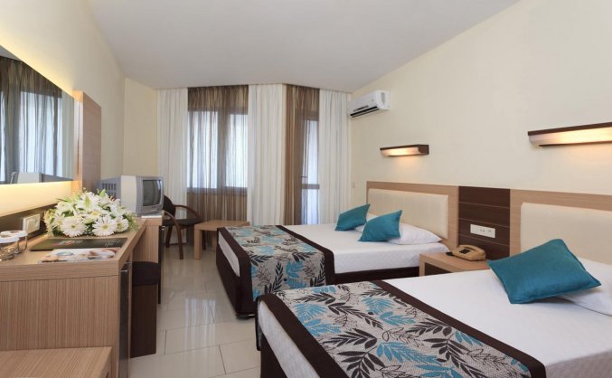 Slaapkamer van Hotel Monart City in Alanya