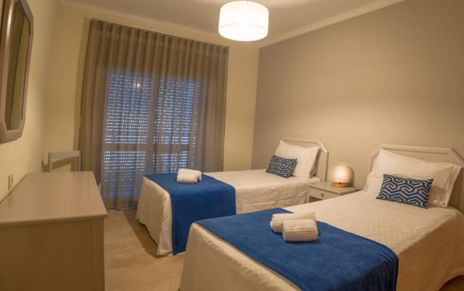 Slaapkamer van Aparthotel Flor Da Rocha in de Algarve