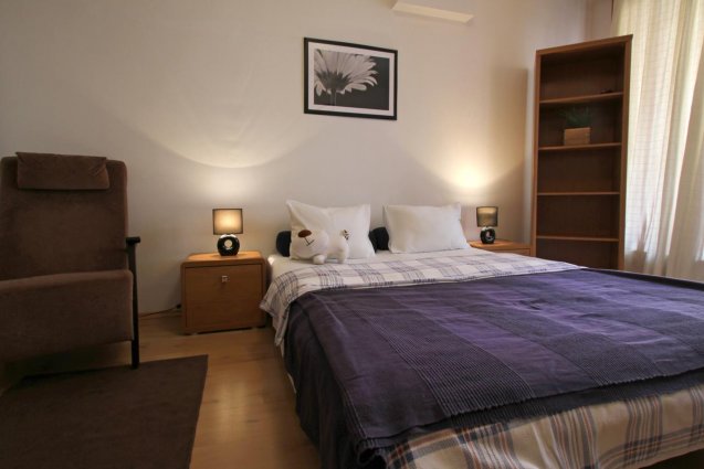 Slaaphoek van een studio van Opera Residence in Budapest