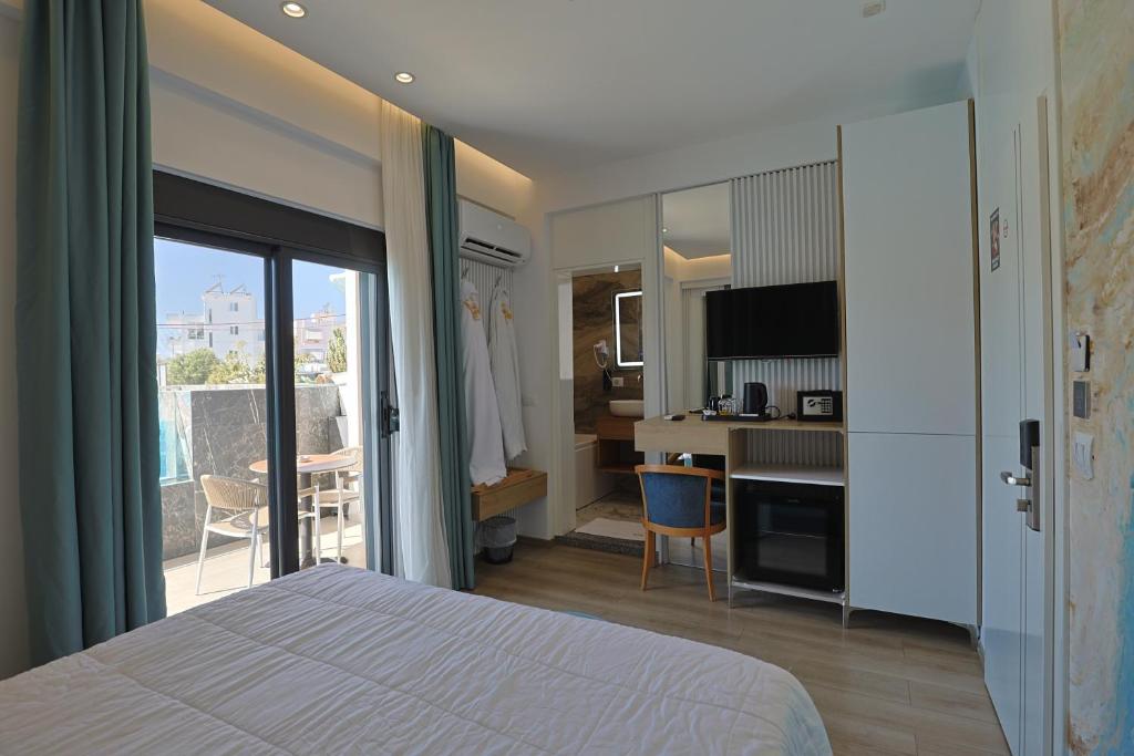 Ilio Boutique Hotel - slaapkamer met balkon