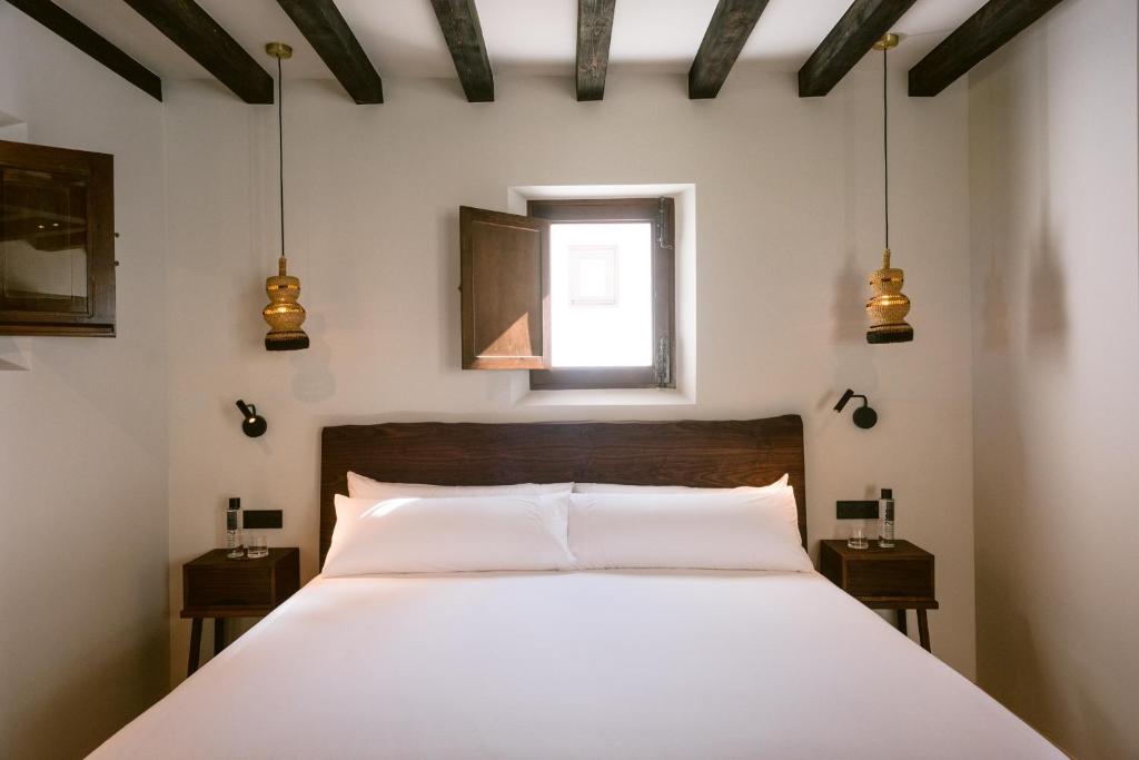 Casa Maca - slaapkamer met hanglampen