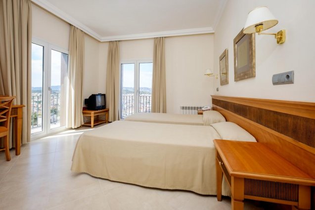Slaapkamer van Hotel Montjoi by Brava Hoteles