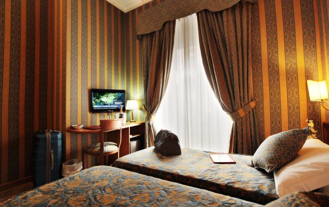 Slaapkamer van hotel Solis in Rome