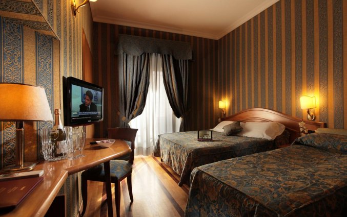 Slaapkamer van hotel Solis in Rome